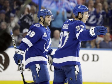 Tampa Bay Lightning center Yanni Gourde (37) celebrates his goal against the Ottawa Senators with center Cory Conacher (89) during the second period of an NHL hockey game Thursday, Dec. 21, 2017, in Tampa, Fla.