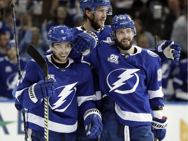 Tampa Bay Lightning center Tyler Johnson, left, celebrates his goal against the Ottawa Senators with defenseman Victor Hedman, center, and right wing Nikita Kucherov, right, during the second period of an NHL hockey game Thursday, Dec. 21, 2017, in Tampa, Fla.