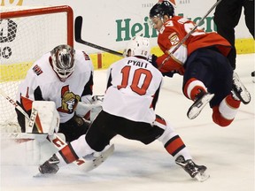 Florida Panthers' Evgenii Dadonov attempts a shot on Ottawa Senators goalie Mike Condon.
