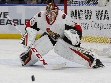Ottawa Senators goalie Mike Condon (1) makes a save during the first period of an NHL hockey game against the Buffalo Sabres, Tuesday Dec. 12, 2017, in Buffalo, N.Y.