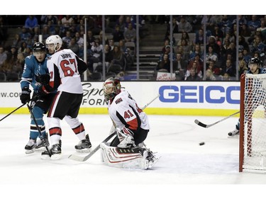 Ottawa Senators goalie Craig Anderson (41) gives up a goal to San Jose Sharks defenseman Marc-Edouard Vlasic, not seen, during the second period of an NHL hockey game Saturday, Dec. 9, 2017, in San Jose, Calif.