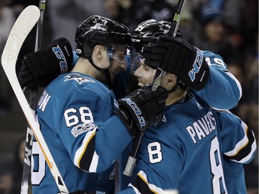 The Sharks' Melker Karlsson celebrates his goal with Joe Pavelski during the second period.