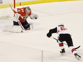 Florida Panthers goalie James Reimer makes a save against Ottawa Senators' Erik Karlsson, right, of Sweden, during the second period, Saturday, Dec. 23, 2017, in Sunrise, Fla. (AP Photo/Luis M. Alvarez)