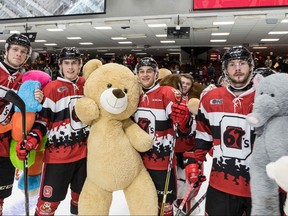 Members of the Ottawa 67's pose with stuffed toys on Teddy Bear Toss day, Dec. 10, 2017. (alerie Wutti, Blizten Photography/Ottawa 67's.)