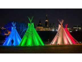Lighting of the Tipis: Seven tipis have been installed on the grounds of the Museum of Canadian History and will be illuminated every evening until New Year's Day and they represent the seven-generations and the seven sacred Indigenous teachings of the First Nations. Photo Wayne Cuddington/ Postmedia