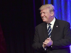 U.S. President Donald Trump walks on stage to speak at a fundraiser at Cipriani in New York, Saturday, Dec. 2, 2017. Trump is attending a trio of fundraisers during his day in New York. (AP Photo/Susan Walsh)