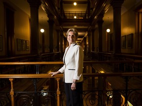 Ontario Premier Kathleen Wynne poses for a photograph at Queen's Park in Toronto on Monday, December 18, 2017. THE CANADIAN PRESS/Nathan Denette ORG XMIT: NSD201