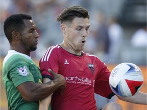 Maxim Tissot, right, battles for possession against the Tampa Bay Rowdies' Darnell King during a Fury FC NASL game in Ottawa in July 2016.   Patrick Doyle/Postmedia files