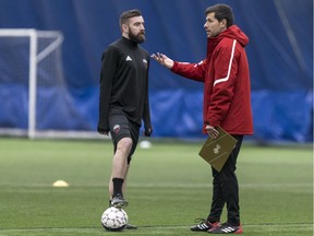 Ottawa Fury FC head coach Nikola Popovic (R) speaks with defender Colin Falvey during the first day of training camp. January 29,2018.