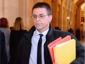 Hassan Diab (R), who was arrested in November 2008 for his alleged role in a 1980 Paris synagogue bombing, and his lawyer William Bourdon, arrive at the courthouse on Mai 24, 2016 in Paris.  A French court will decide on May 24, 2016 whether Diab will go back to jail, after he was placed under house arrest with an electronic bracelet.