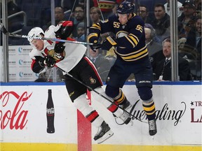 Senators defenceman Dion Phaneuf collides with the Sabres' Rasmus Ristolainen in a game on Dec. 12.