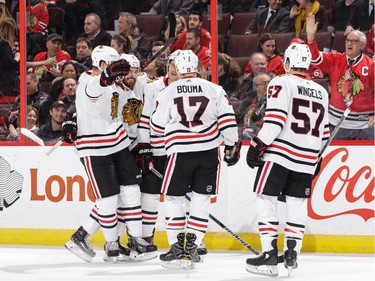 OTTAWA, ON - JANUARY 9: Richard Panik #14 of the Chicago Blackhawks celebrates his first period goal against the Ottawa Senators with teammates Connor Murphy #5, Michal Kempny #6, Tommy Wingels #57 and Lance Bouma #17 at Canadian Tire Centre on January 9, 2018 in Ottawa, Ontario, Canada.