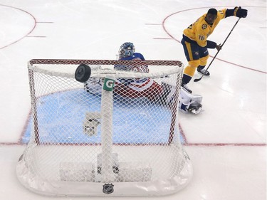 A shot by Nashville's P. K. Subban flies over the net protected by the New York Rangers' Henrik Lundqvist in the "save streak" event.