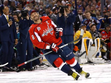 Alexander Ovechkin of the Washington Capitals celebrates after getting into the lead in the hardest-shot competition.