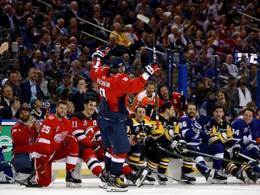 Alexander Ovechkin of the Capitals basks in the cheers of fans and NHL counterparts after winning the hardest-shot event.