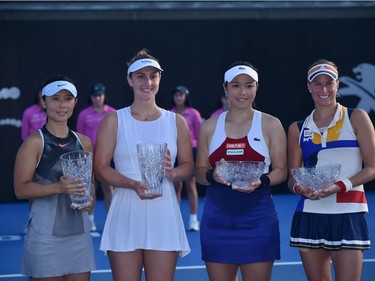 Yifan Xu, far left, of China and Gabriela Dabrowski of Ottawa pose with their trophy after winning women's doubles final final of the Sydney International against Taiwan's Chan Yung-Jan, second from right, and Czech Republic's Andrea Sestini Hlavackova.
