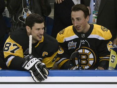 Pittsburgh Penguins forward Sidney Crosby and Boston Bruins forward Brad Marchand, who is participating in all-star game weekend events despite being suspended by the NHL, share a laugh during the skills competition.