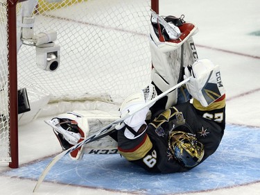 Vegas Golden Knights goalie Marc-André Fleury (29) flips over after making a save on a shot by Tampa Bay Lightning forward Brayden Point during the save streak event.