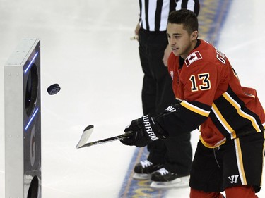 Calgary Flames forward Johnny Gaudreau flips the puck during the puck control relay. Gaudreau won the event.