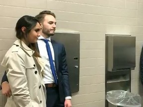 In this screenshot, Maria Schulz and Brian Shulz get married in a courthouse bathroom.