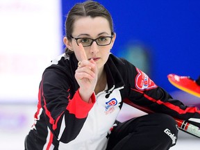 Ontario's second Cheryl Kreviazuk signals as she throws a stone while taking on Alberta at the Scotties Tournament of Hearts in Penticton, B.C., on Saturday, Jan. 27, 2018. THE CANADIAN PRESS/Sean Kilpatrick