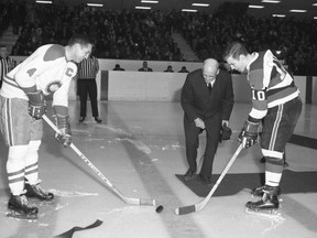 67's captain Bill Clement nervously works the ceremonial faceoff with Montreal Canadiens great Jean Beliveau at the Ottawa Civic Centre on Jan. 22, 1968.