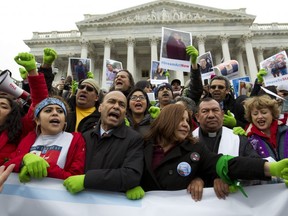 In this Dec. 6, 2017 photo, Rep. Luis Gutierrez D-Ill., third from left, along with other demonstrators protest outside of the U.S. Capitol in support of the Deferred Action for Childhood Arrivals (DACA), and Temporary Protected Status (TPS), programs. ( AP Photo/Jose Luis Magana)