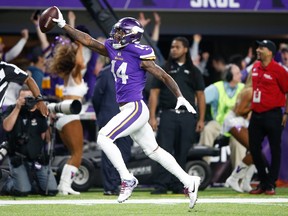 Stefon Diggs of the Minnesota Vikings scores the winning touchdown as time expires against the New Orleans Saints during the NFC Divisional Playoff on Jan. 14. (Getty Images)