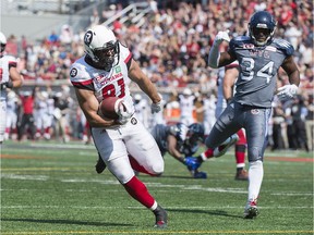 Fullback Patrick Lavoie runs in for a touchdown during the first half of the Redblacks' game against the Alouettes in Montreal last Sept. 17.