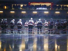 Belleville Senators assemble on the ice surface at Yardmen Arena before their first regular-season game in the facility on Nov. 1. Luke Hendry/Postmedia