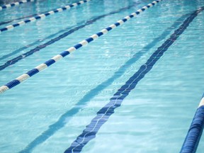 In this stock photo, an empty swimming pool with line dividers sits ready for a race.