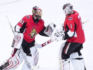 Ottawa Senators goaltender Craig Anderson, left, gets replaced by Mike Condon during the second period of NHL hockey action in Ottawa on Tuesday, Jan. 9, 2018.