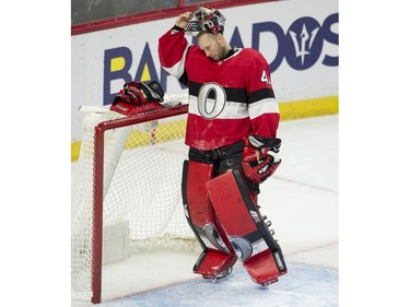 Ottawa Senators goaltender Craig Anderson (41) removes his mask following the St. Louis Blues' second goal during the second.