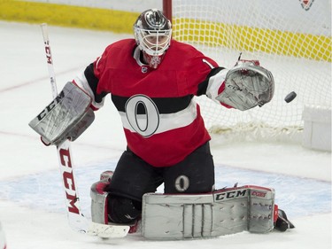 Ottawa Senators goaltender Mike Condon watches the puck go wide of the net.