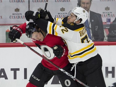 Boston Bruins centre Frank Vatrano collides with Ottawa Senators defenceman Thomas Chabot.