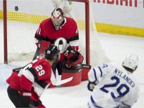 Toronto Maple Leafs centre William Nylander fires the puck wide of the net past Ottawa Senators goaltender Craig Anderson as defenceman Johnny Oduya looks on during the first period on Saturday, Jan. 20, 2018 in Ottawa.