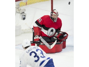 Ottawa Senators goaltender Craig Anderson keeps his eye on the puck as a shot from Toronto Maple Leafs centre Frederik Gauthier goes wide of the net.