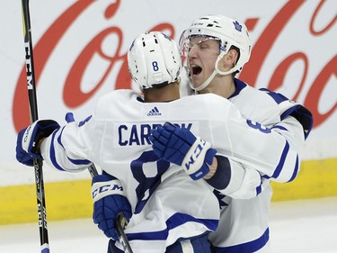 Toronto defenceman Connor Carrick (8) is congratulated by teammate Travis Dermott (23) after scoring the go-ahead goal during the third period of Saturday's game.