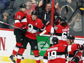 Senators right-winger Mark Stone, second from left, celebrates his third-period goal against the Lightning with teammates Ryan Dzingel (18), Erik Karlsson (65), Derick Brassard (19) and Thomas Chabot, far right.