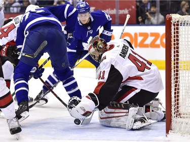Ottawa Senators goaltender Craig Anderson (41) makes a save in front of Toronto Maple Leafs left wing James van Riemsdyk (25) and centre Tyler Bozak (42) during second period NHL hockey action in Toronto on Wednesday, January 10, 2018.
