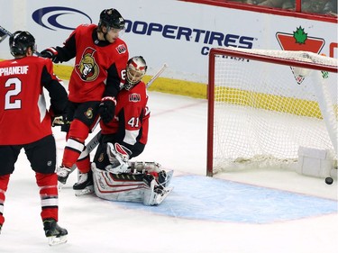 The San Jose Sharks' Melker Karlsson scores on Ottawa goaltender Craig Anderson, while the Senators' Mike Hoffman (68) and Dion Phaneuf (2) look on.
