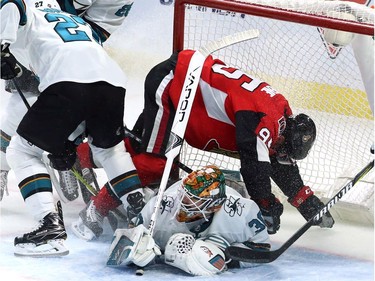 The Ottawa Senators' Matt Duchene (95) crashes into San Jose Sharks' goaltender Aaron Dell (30).