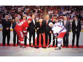A ceremonial faceoff marks opening night for the Arizona Coyotes ownership group on Oct. 3, 2013. The NHL game featured the Coyotes and the visiting New York Rangers. Gary Drummond is at far left, Anthony LeBlanc is second from right. Norm Hall/NHLI via Getty Images.