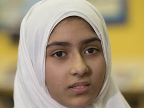 An emotional Khawlah Noman, 11, recalls a man slicing her hijab with scissors as she and her brother Mohammad Zakarijja walked to Pauline Johnson Public School in Scarborough on Friday, Jan. 12, 2018.