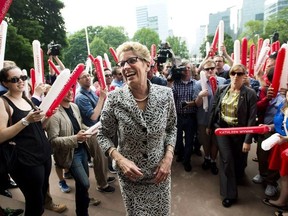 Ontario Premier Kathleen Wynne greets supporters and staff after winning a majority government at Queen's Park in Toronto on Friday, June 13, 2014.