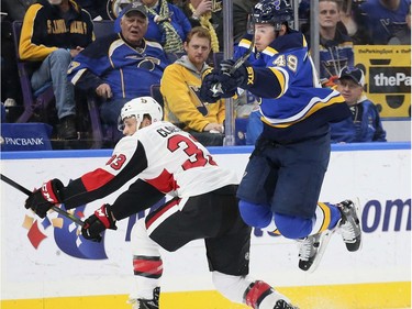 St. Louis Blues center Ivan Barbashev, right, tries to hop past Ottawa Senators defenseman Fredrik Claesson during the first period of an NHL hockey game Tuesday, Jan. 23, 2018, in St. Louis. (Chris Lee/St. Louis Post-Dispatch via AP) ORG XMIT: MOSTP321