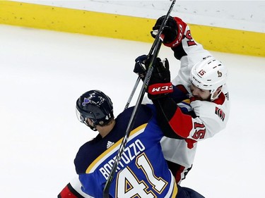 St. Louis Blues' Robert Bortuzzo (41) and Ottawa Senators' Zack Smith (15) collide during the second period of an NHL hockey game Tuesday, Jan. 23, 2018, in St. Louis.