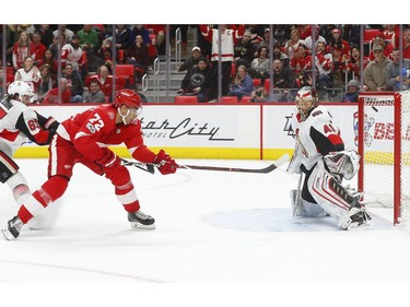 The Detroit Red Wings' Andreas Athanasiou scores on Ottawa Senators goaltender Craig Anderson in overtime.