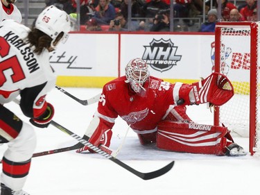 Detroit Red Wings goaltender Jimmy Howard stops a shot by Ottawa Senators defenceman Erik Karlsson during the third period.