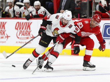 Ottawa Senators centre Derick Brassard and Detroit Red Wings defenceman Trevor Daley vie for the puck during the third period.